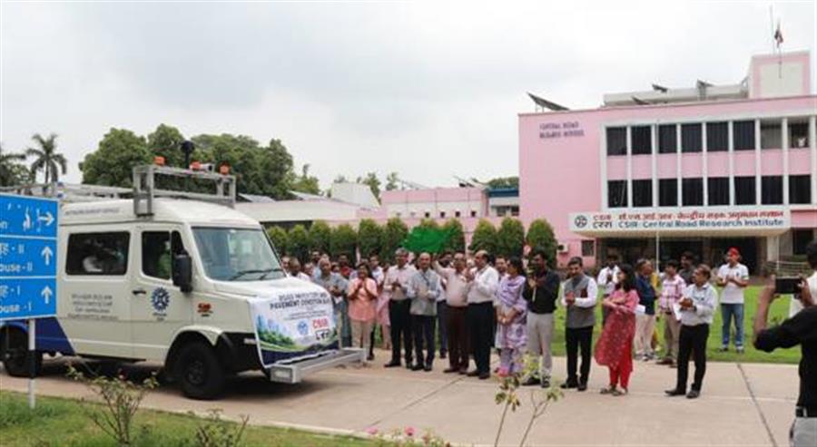 SIR-CRRI flags of indigenous network survey vehicle for urban road motoring